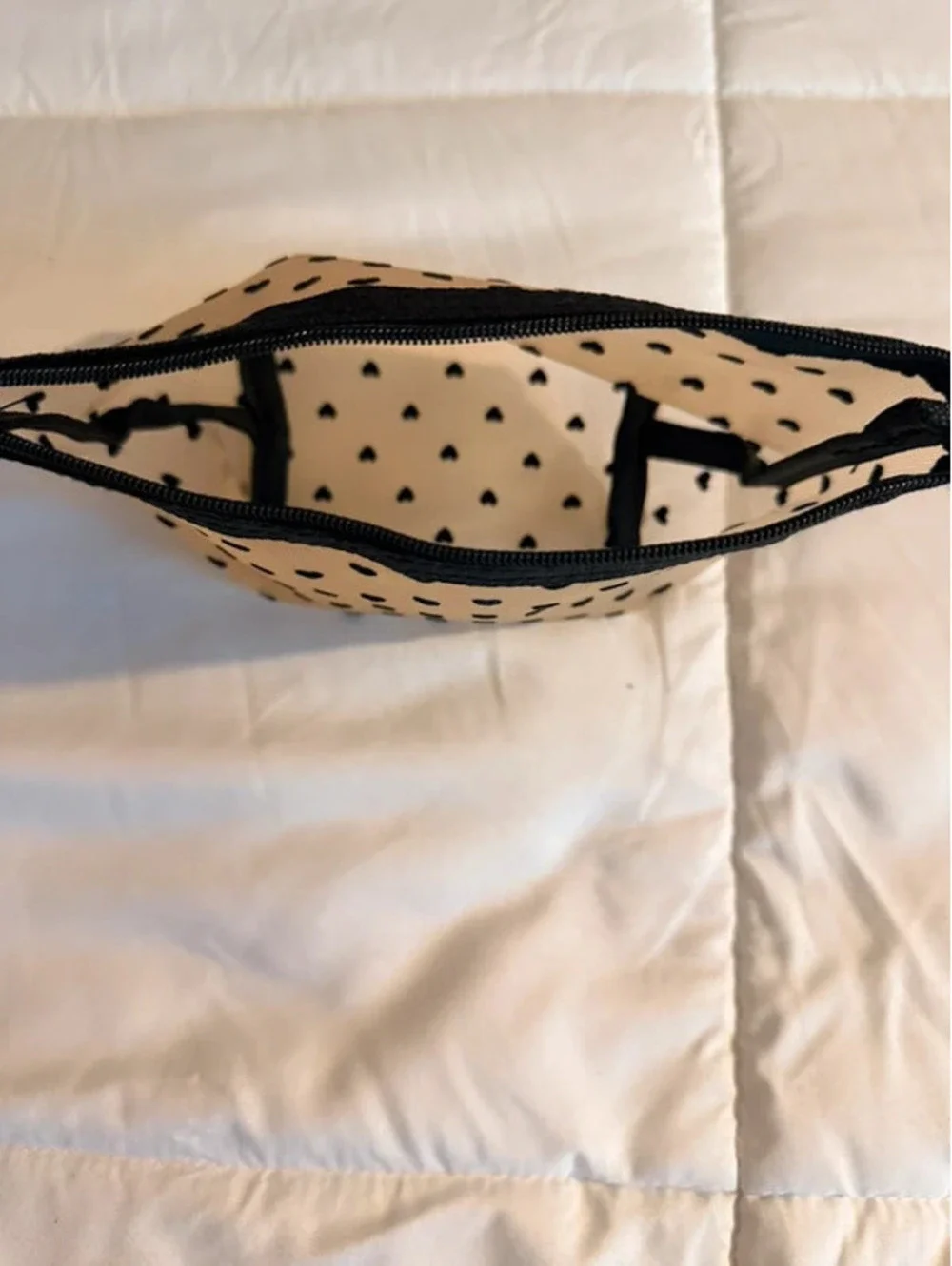 Black heart mesh pouch with black heart pattern on beige